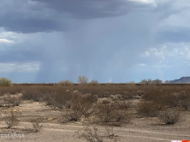a view of an ocean with a mountain