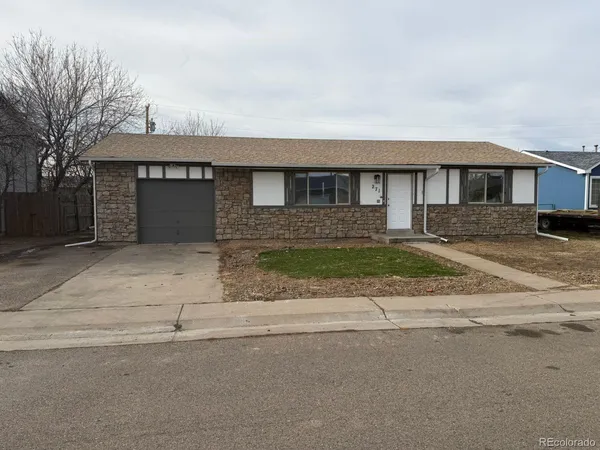 front view of a house with a road