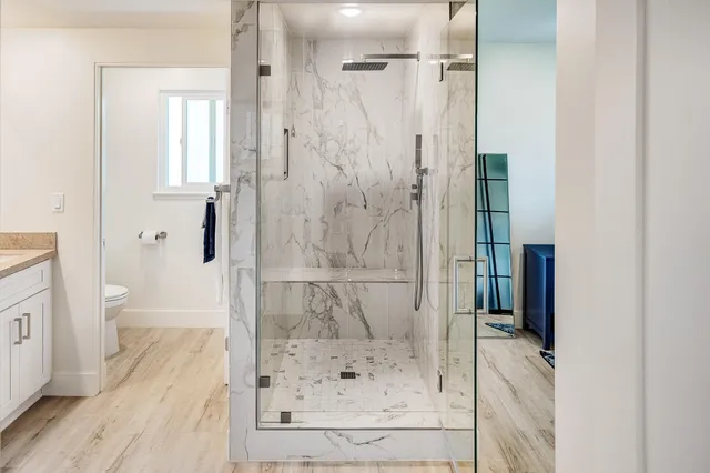 a bathroom with a bathtub and a shower
