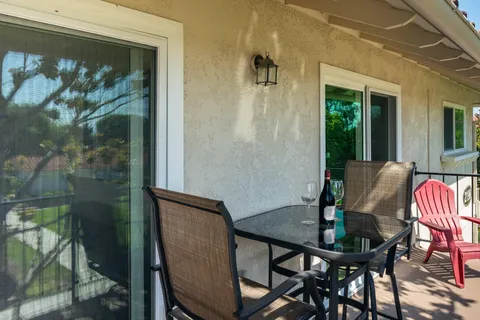 a view of a balcony dining area