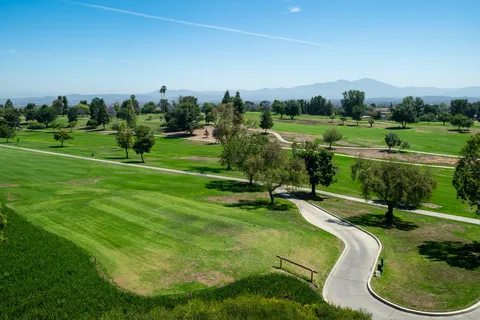 a view of a golf course with a lake