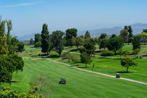 a view of a golf course with a garden