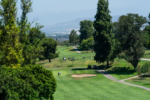 a view of a golf course with a garden