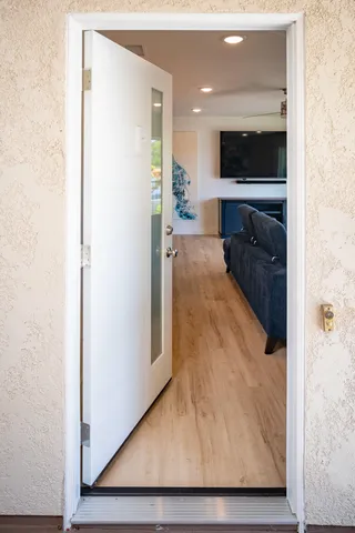 a view of a kitchen from the hallway