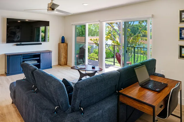 a bedroom with a bed and a television