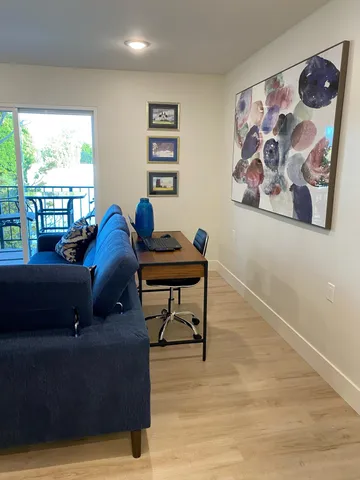 a living room with furniture and a window