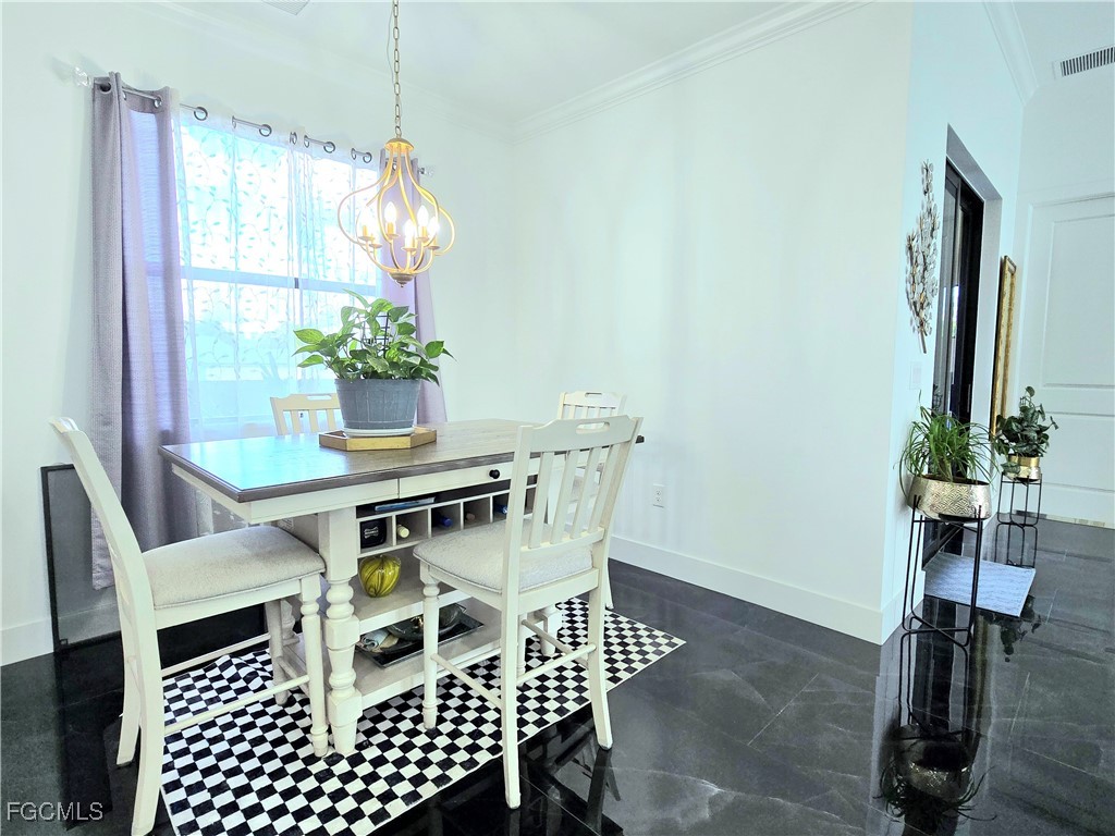 705 Harding Lane Lehigh Acres, FL 33936 - Photo 11 of 38 a view of a dining room with furniture window and outside view
