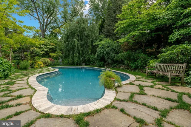 a view of a swimming pool with a outdoor seating