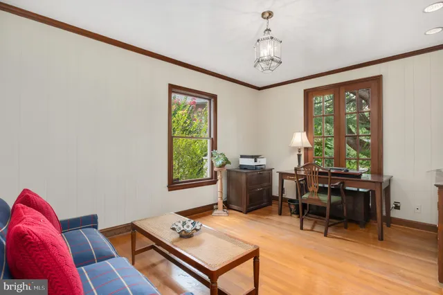 a living room with furniture a window and a table
