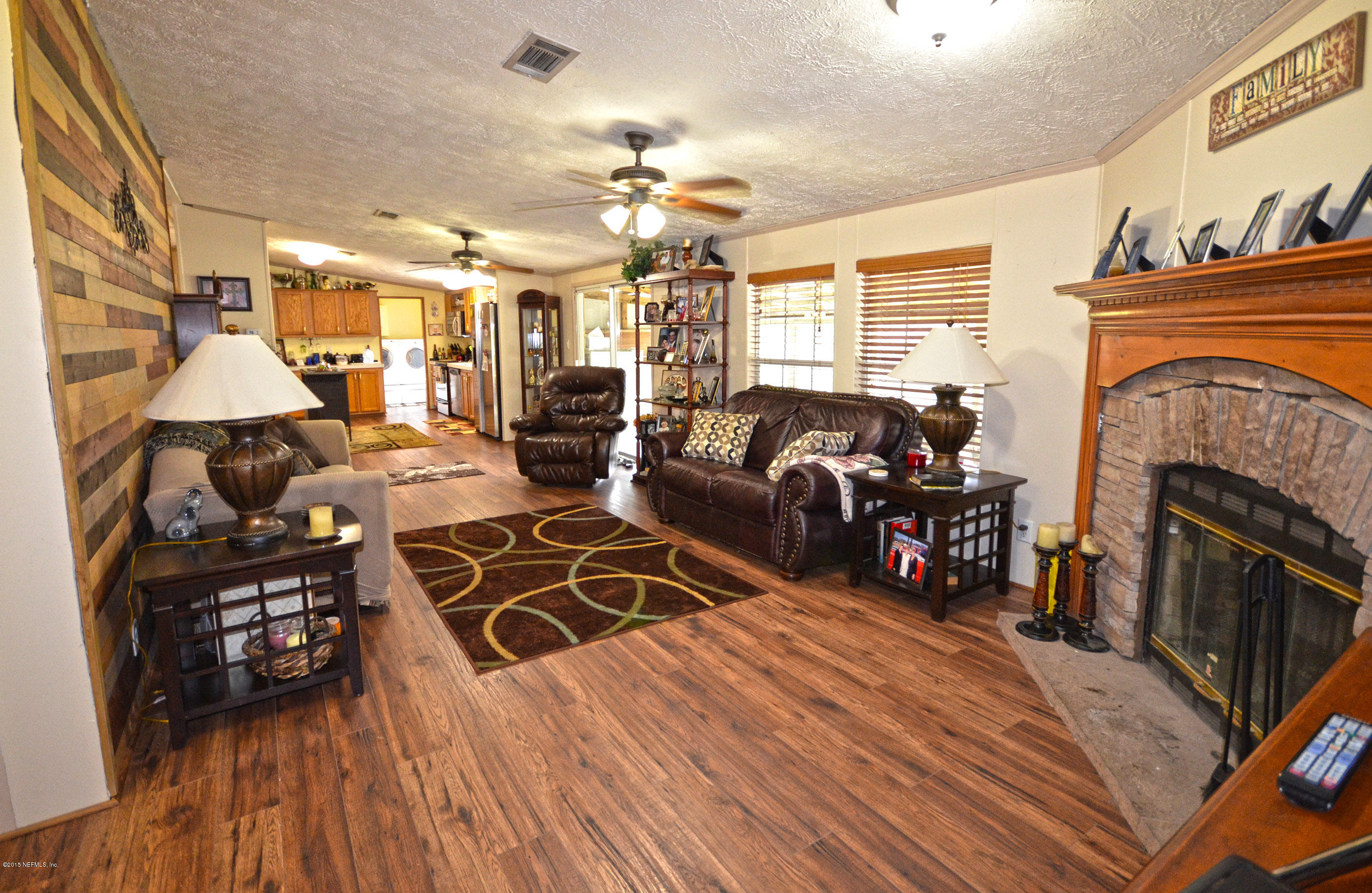 4511 Bondarenko Road Keystone Heights, FL 32656 - Photo 3 of 27 Living room with fireplace