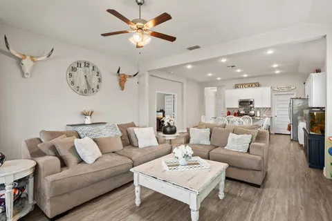 a kitchen with center island table and chairs