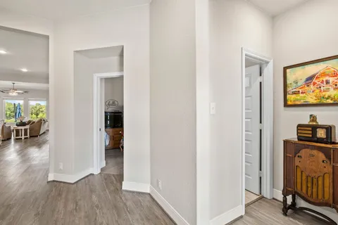 a view of a livingroom with furniture and a flat screen tv