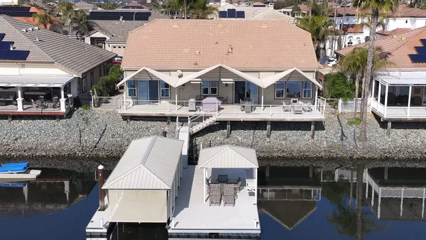 an aerial view of a house with swimming pool