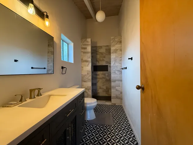 a view of a small space with racks on the wall