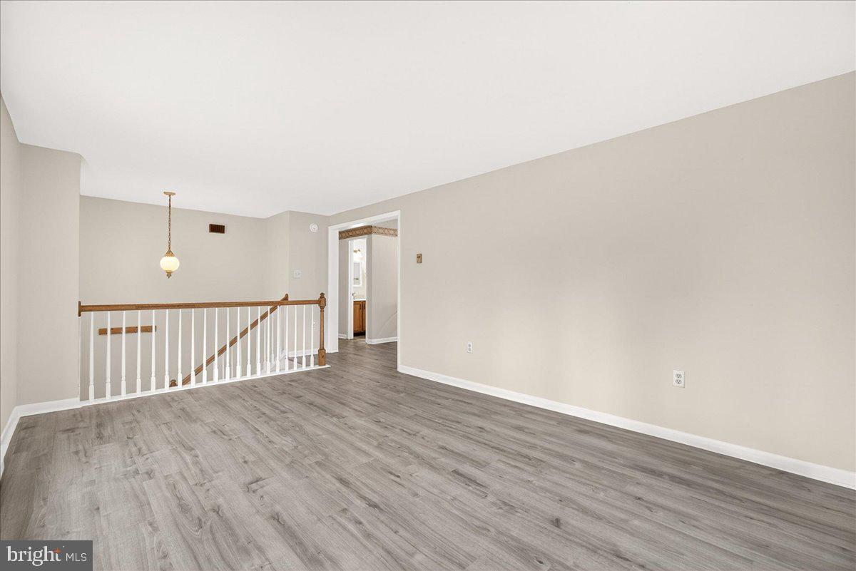 9505 Cabbage Run Road Frederick, MD 21701 - Photo 12 of 50 a view of a hallway with wooden floor