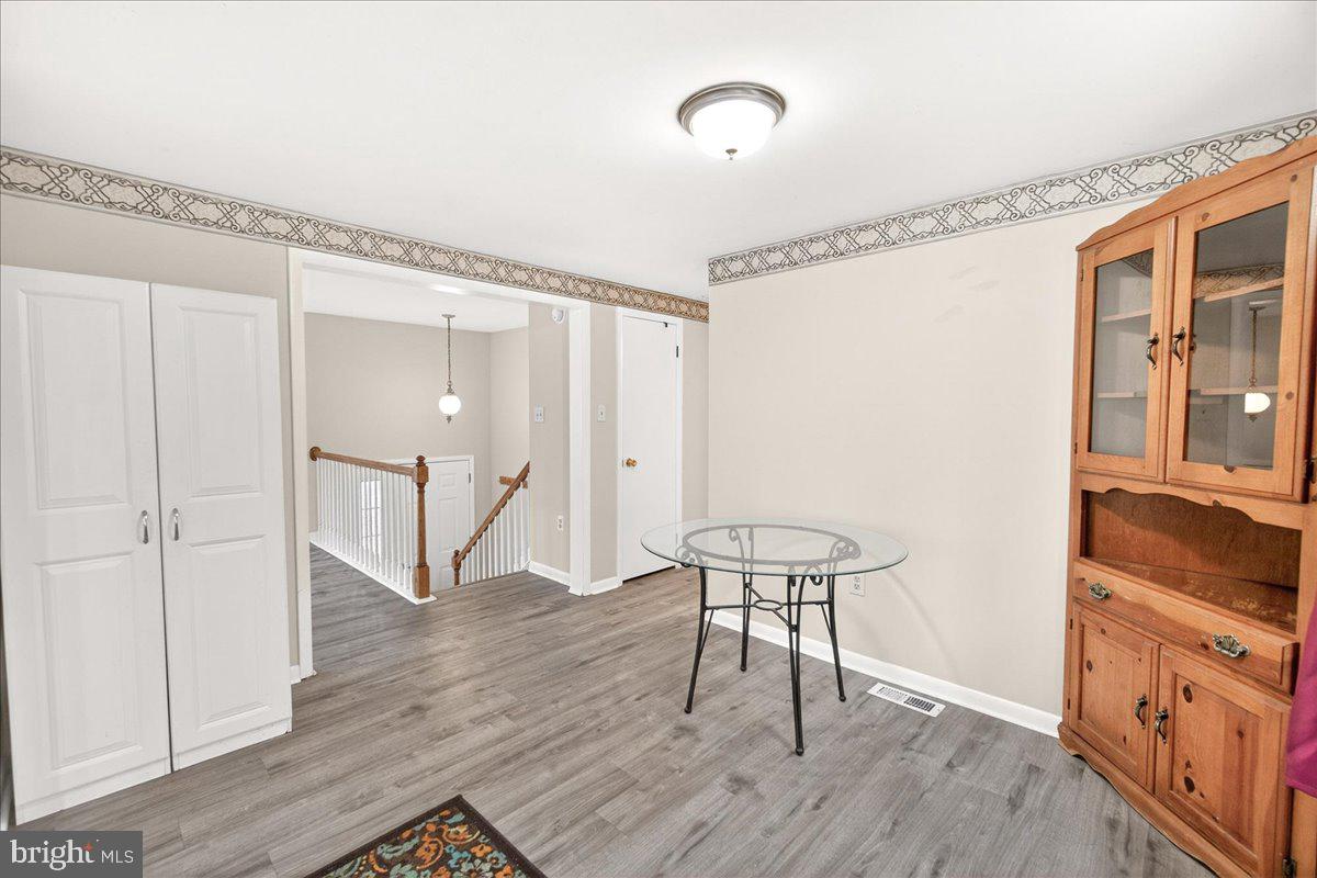 9505 Cabbage Run Road Frederick, MD 21701 - Photo 14 of 50 a view of a room with wooden floor table and chairs
