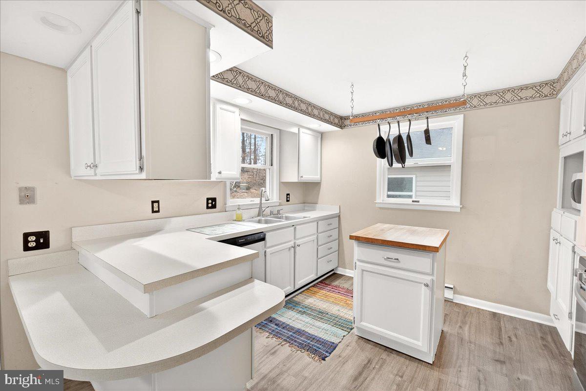 9505 Cabbage Run Road Frederick, MD 21701 - Photo 15 of 50 a kitchen that has a sink and a stove in it