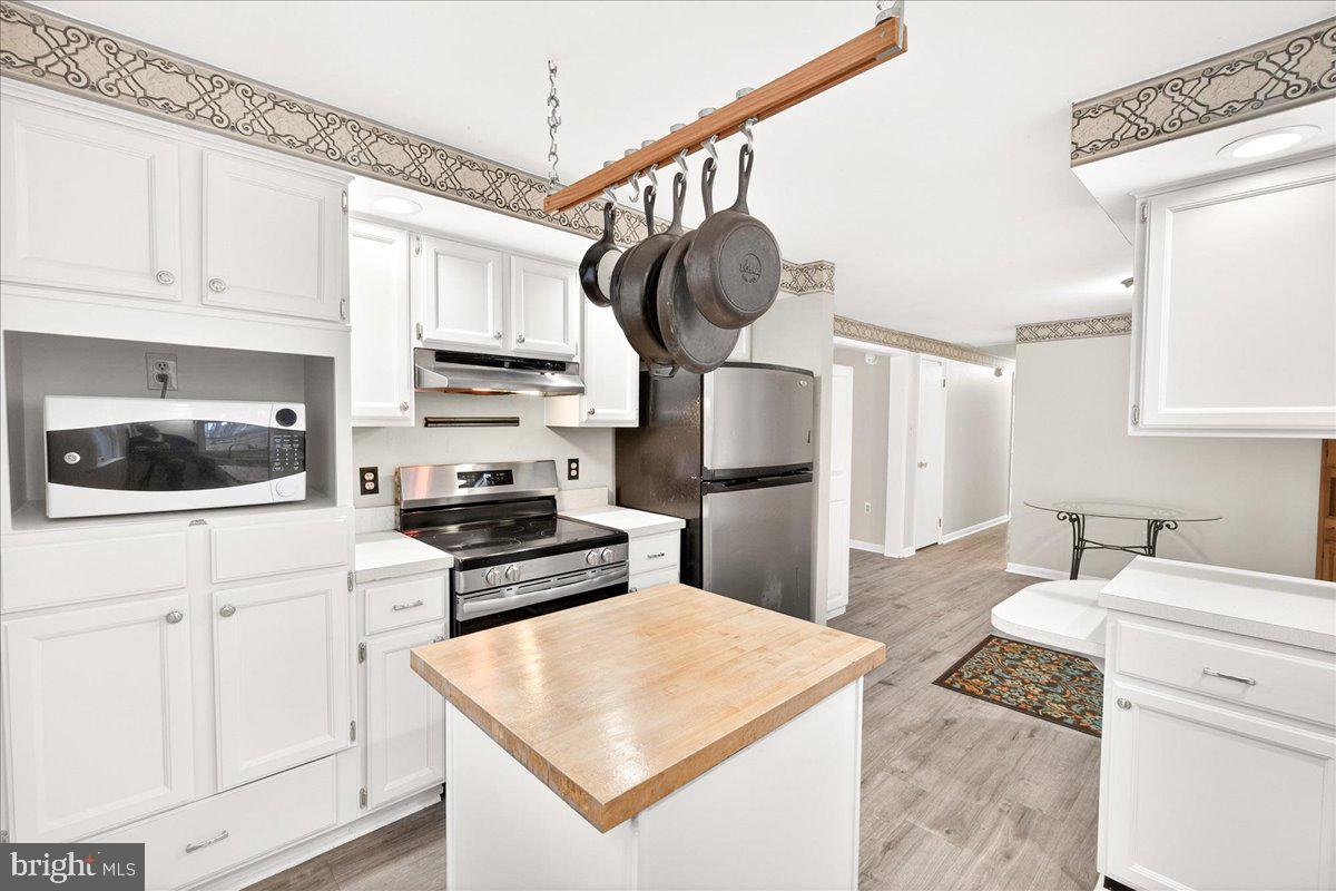 9505 Cabbage Run Road Frederick, MD 21701 - Photo 18 of 50 a kitchen with white cabinets and appliances