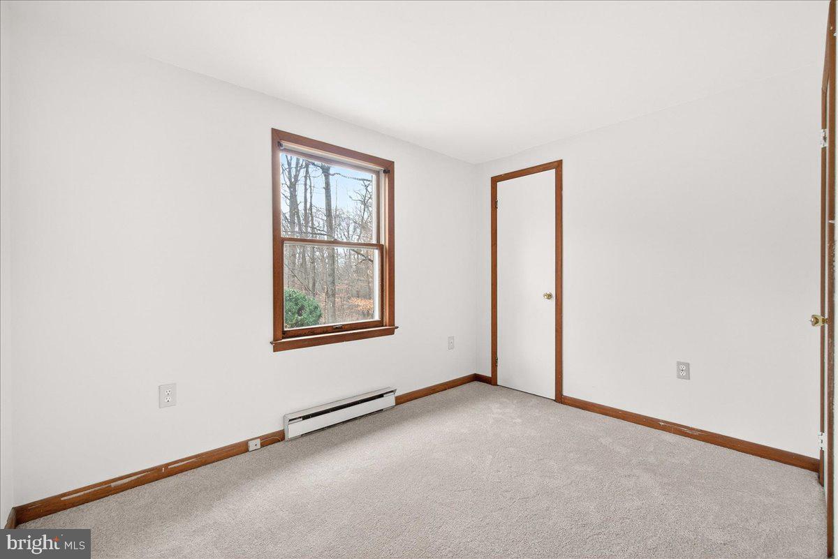 9505 Cabbage Run Road Frederick, MD 21701 - Photo 25 of 50 an empty room with windows