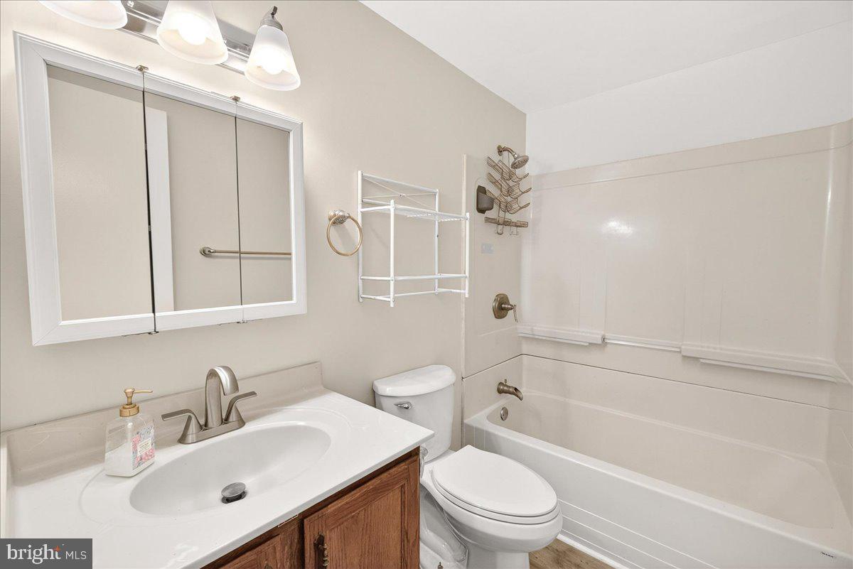 9505 Cabbage Run Road Frederick, MD 21701 - Photo 26 of 50 a bathroom with a bathtub shower sink vanity mirror and toilet