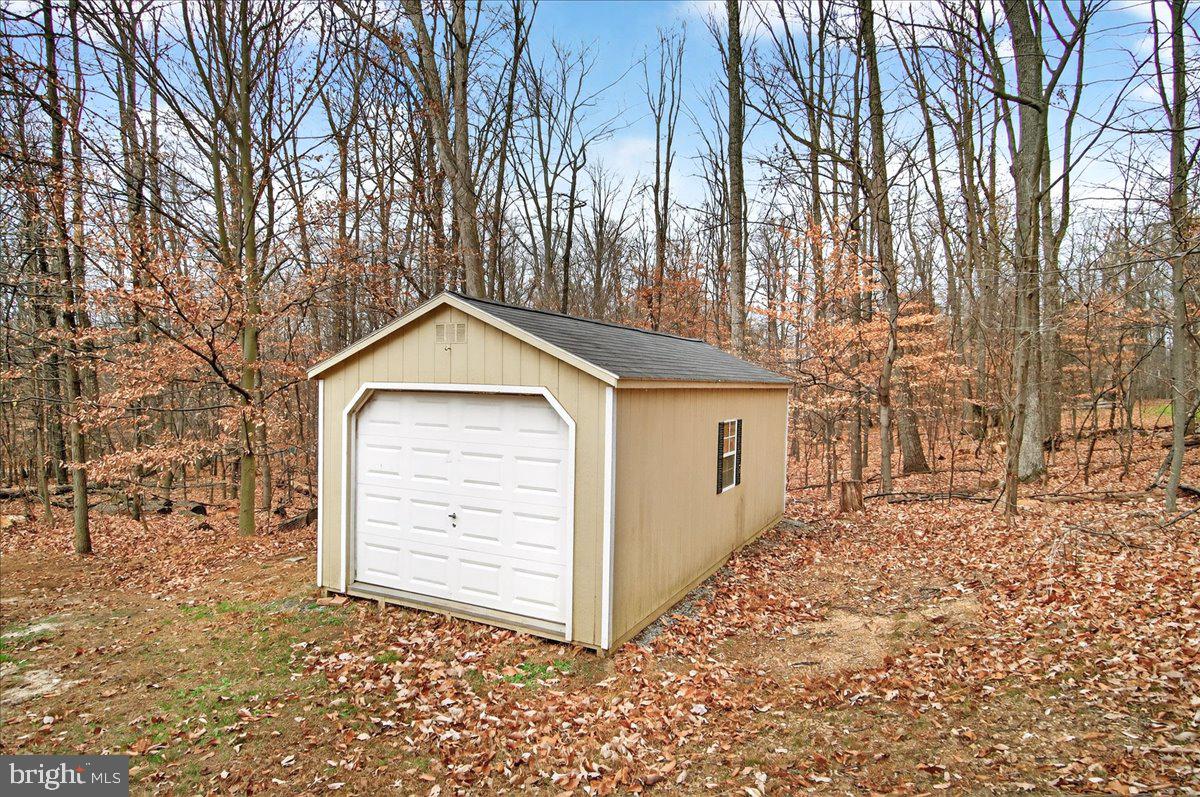 9505 Cabbage Run Road Frederick, MD 21701 - Photo 41 of 50 a view of a house with a yard and garage