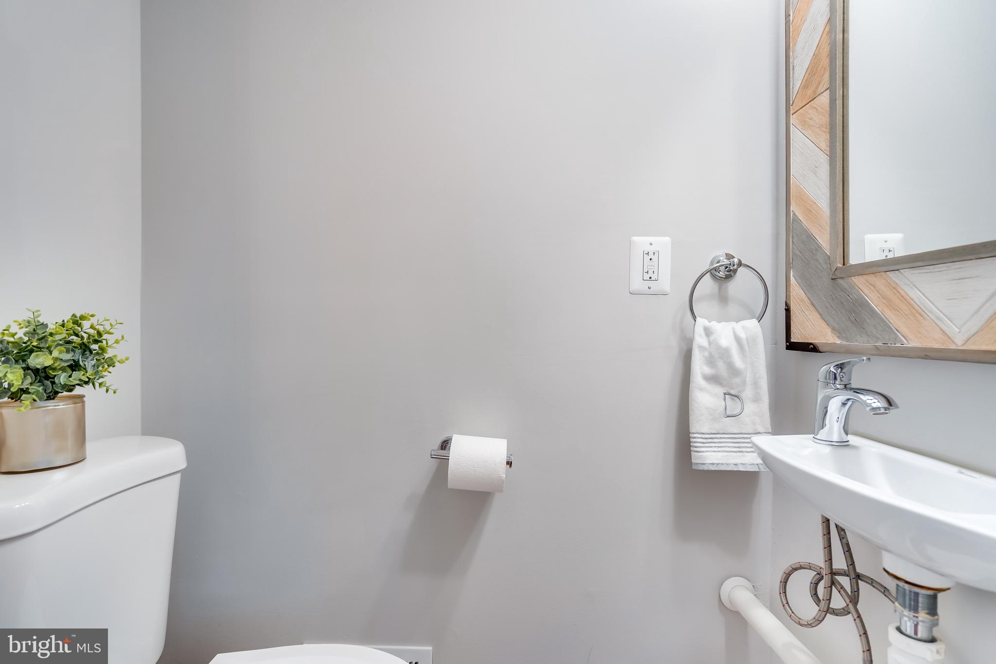 2211 38th Street Northwest Washington, DC 20007 - Photo 14 of 51 a bathroom with a sink and a toilet
