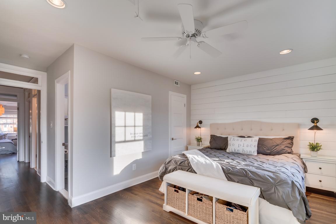 2211 38th Street Northwest Washington, DC 20007 - Photo 20 of 51 a bedroom with a bed and wooden floor