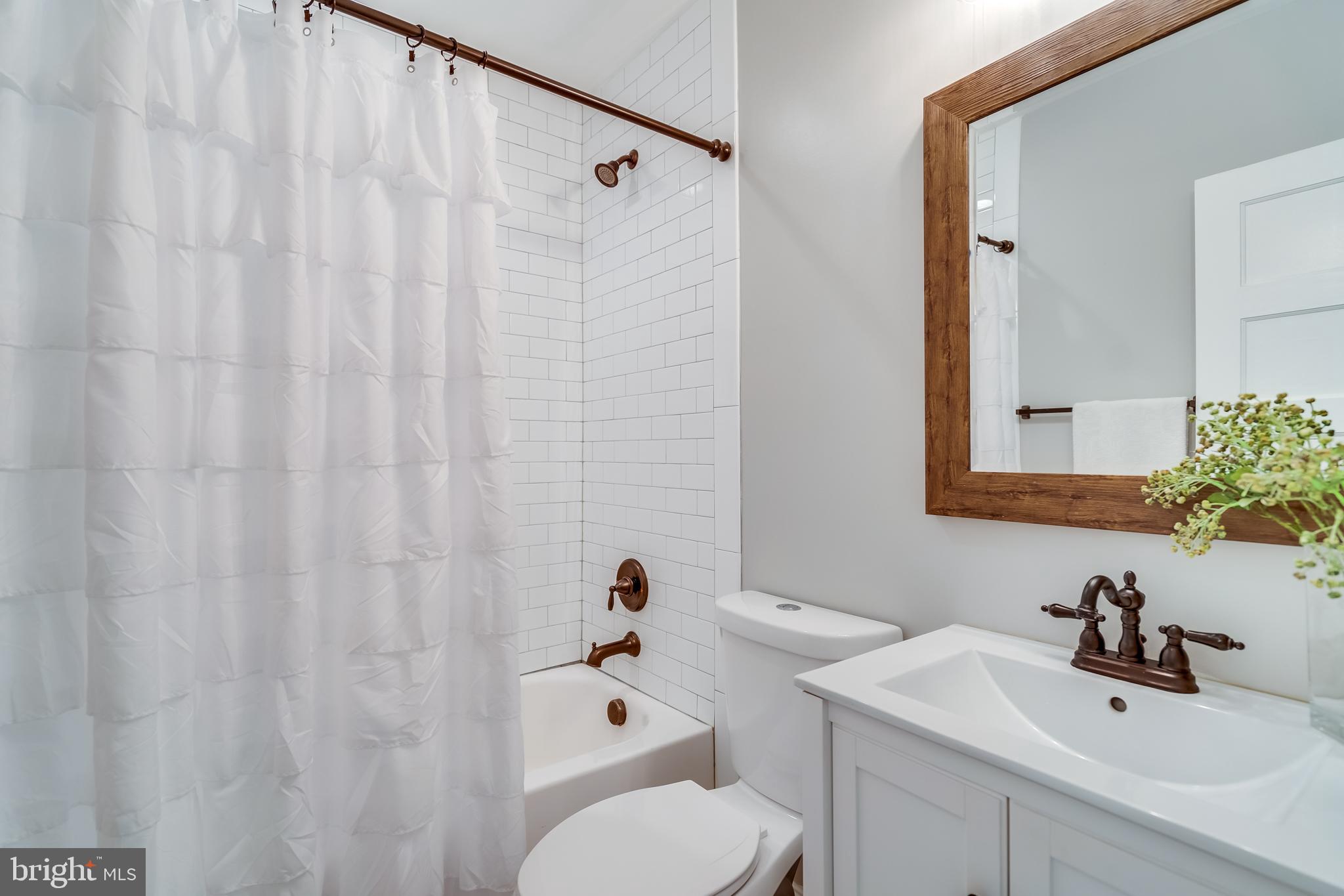 2211 38th Street Northwest Washington, DC 20007 - Photo 24 of 51 a bathroom with a sink and toilet