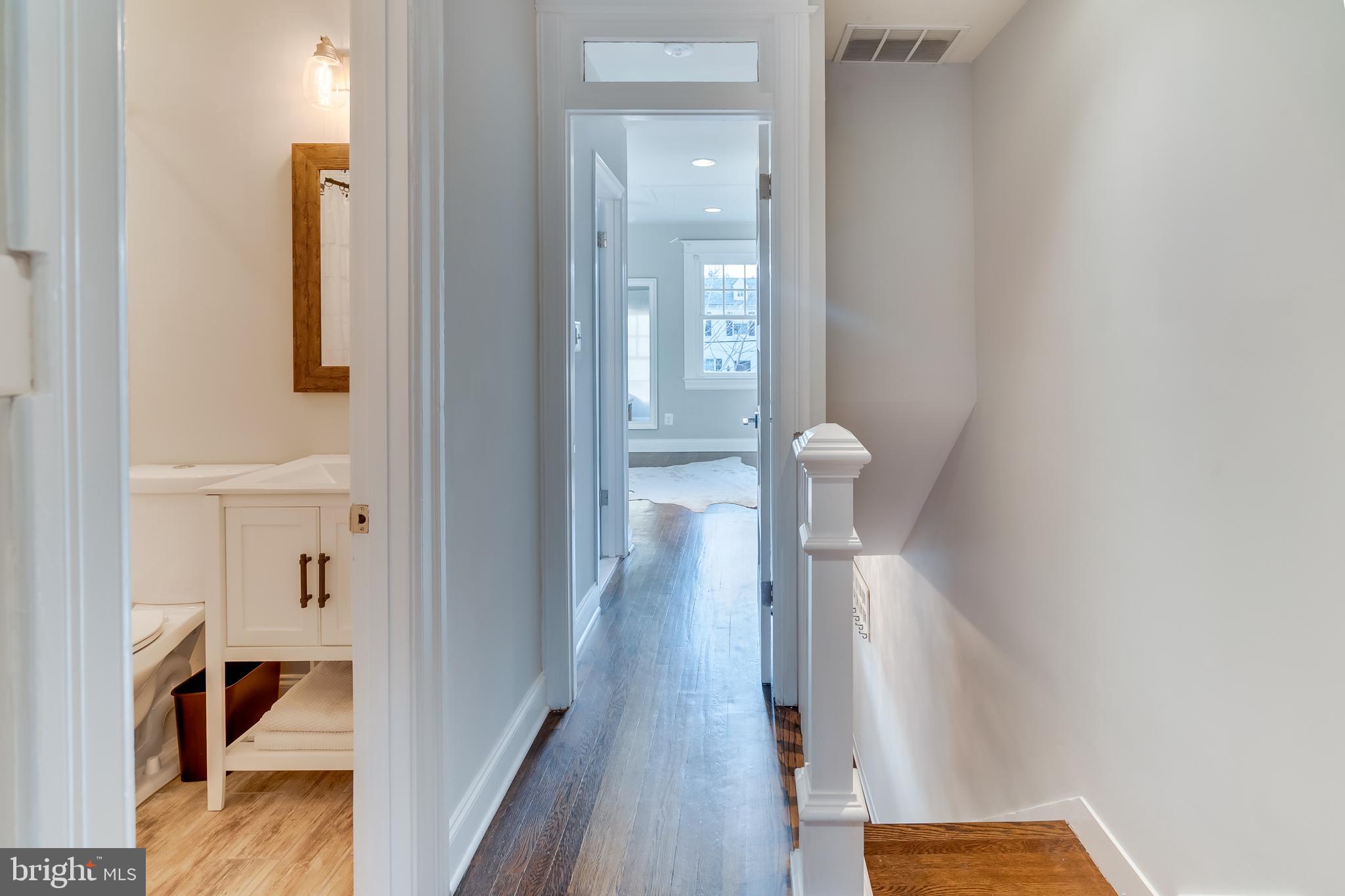 2211 38th Street Northwest Washington, DC 20007 - Photo 26 of 51 a view of hallway with wooden floor