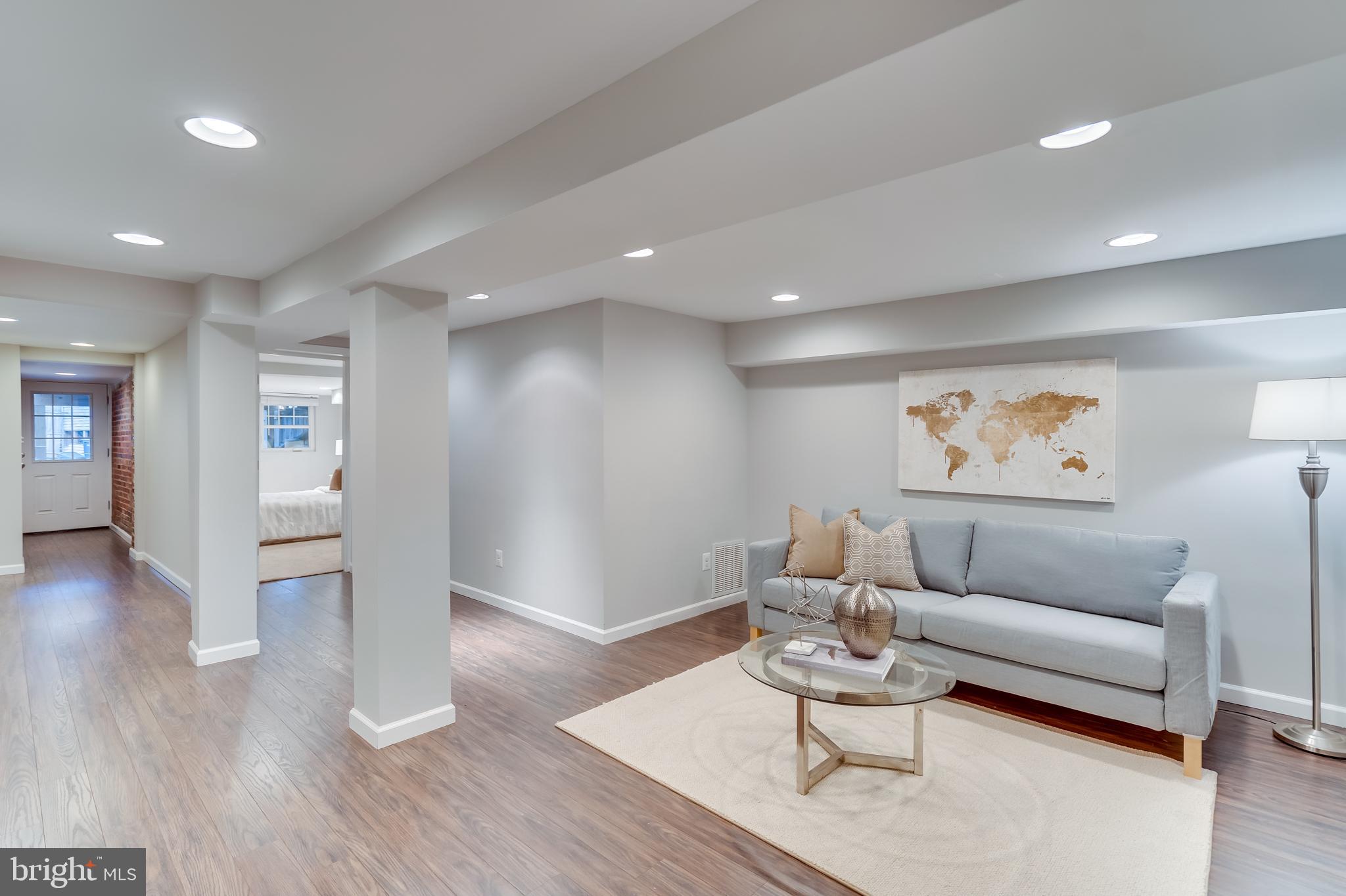 2211 38th Street Northwest Washington, DC 20007 - Photo 27 of 51 a living room with furniture and wooden floor