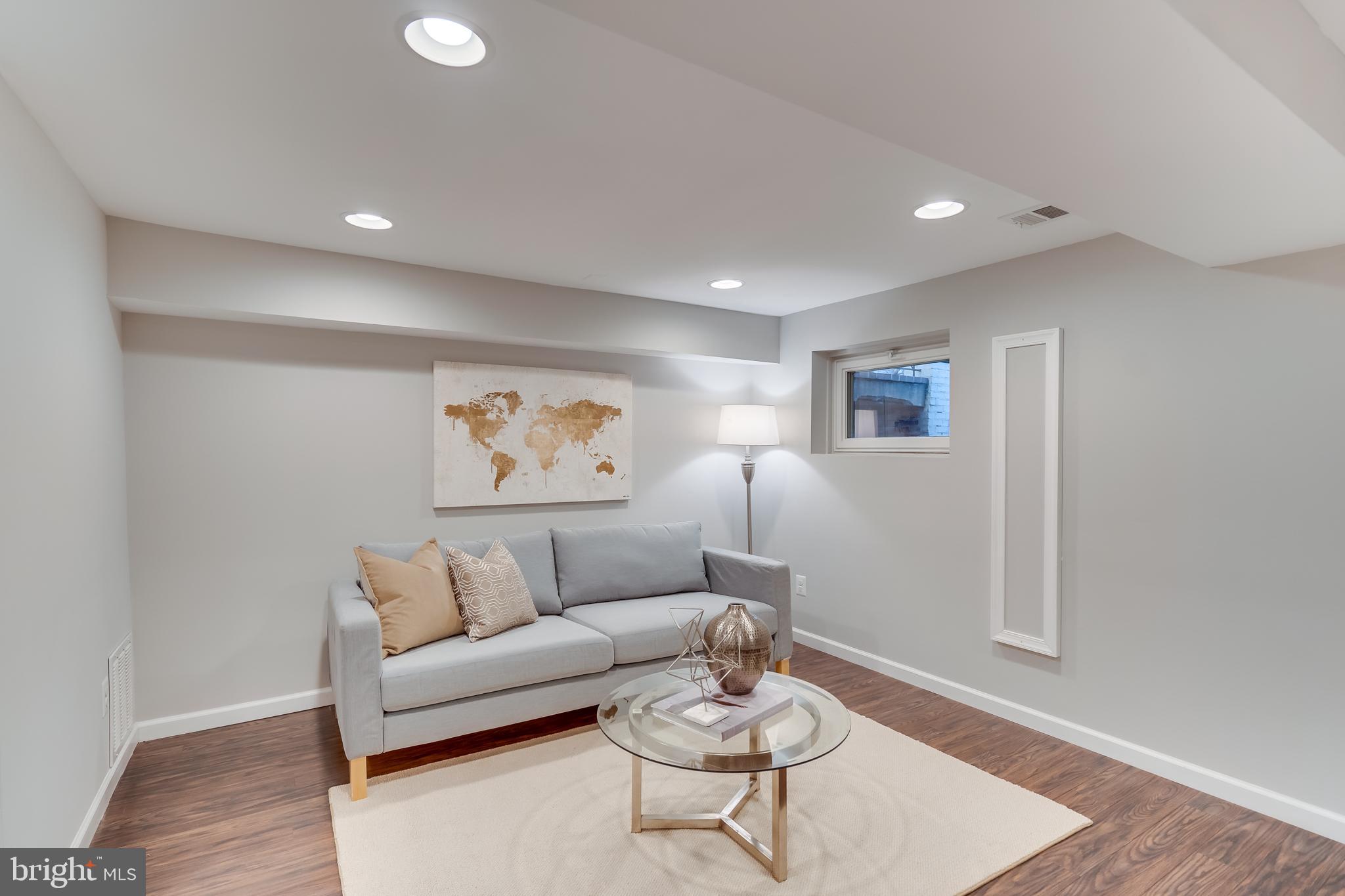 2211 38th Street Northwest Washington, DC 20007 - Photo 28 of 51 a living room with furniture and wooden floor