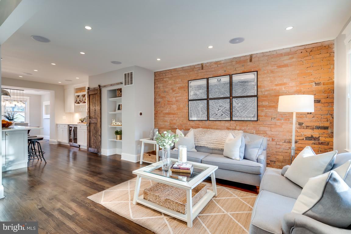 2211 38th Street Northwest Washington, DC 20007 - Photo 4 of 51 a living room with furniture and a large window