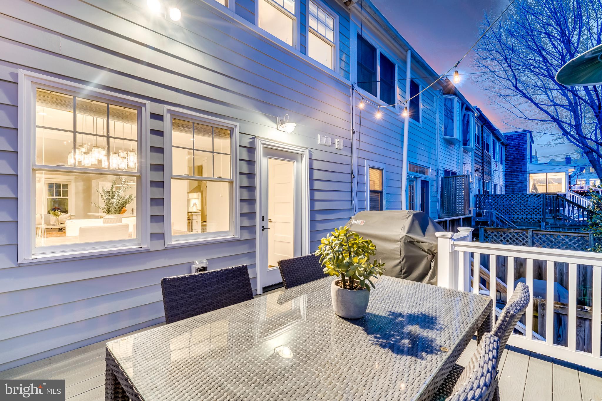 2211 38th Street Northwest Washington, DC 20007 - Photo 38 of 51 a living room with furniture and a potted plant