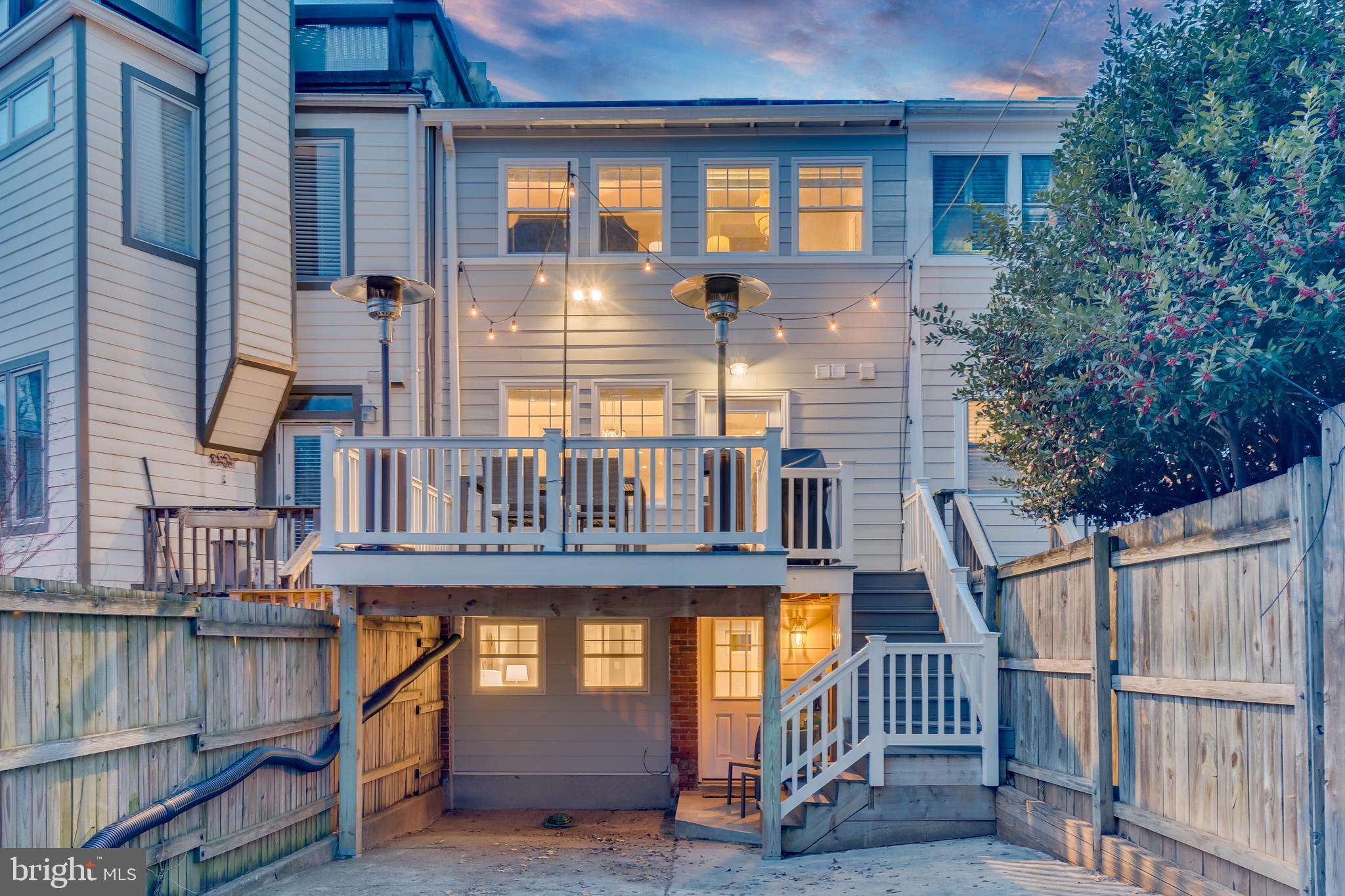 2211 38th Street Northwest Washington, DC 20007 - Photo 40 of 51 a view of a brick house with a small yard