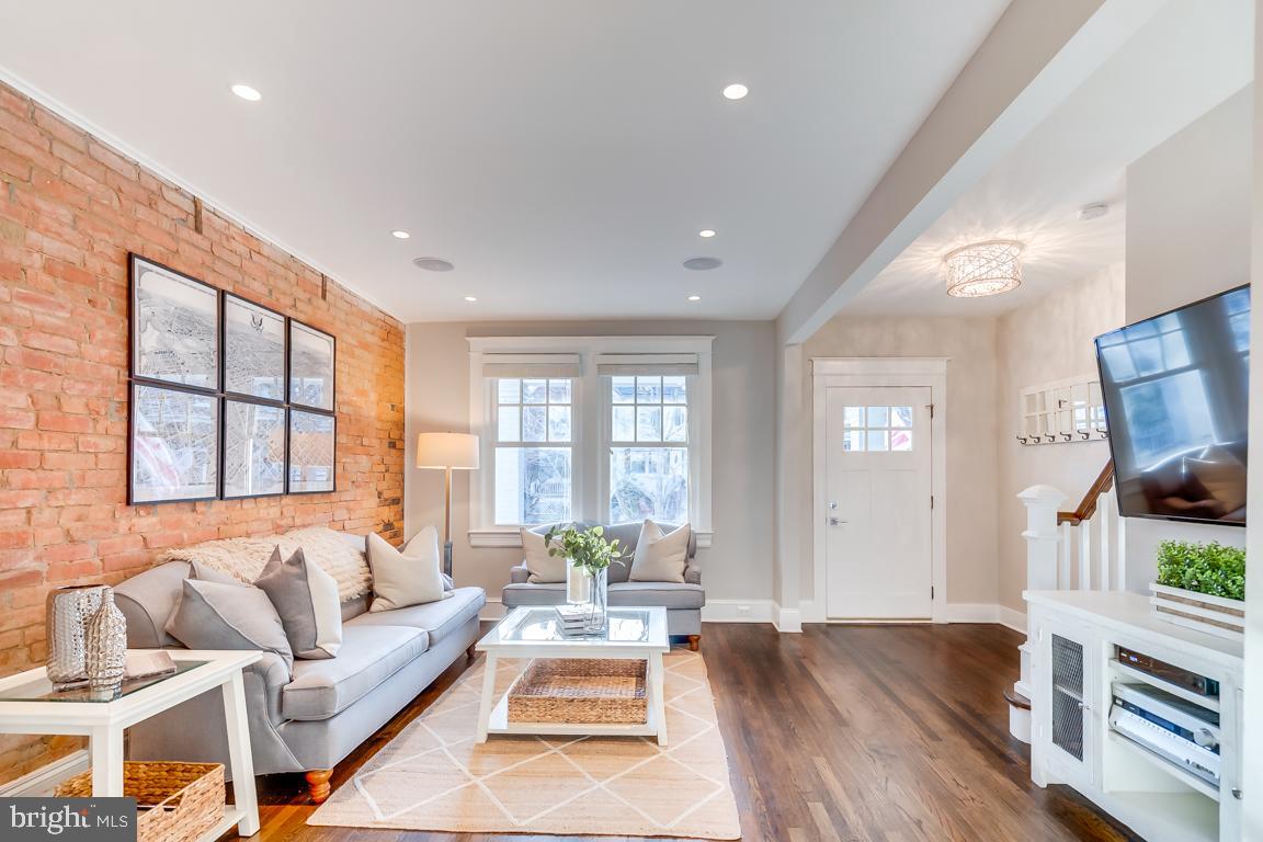 2211 38th Street Northwest Washington, DC 20007 - Photo 6 of 51 a living room with furniture and a flat screen tv