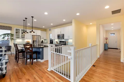 a view of a kitchen with kitchen island dining table and chairs