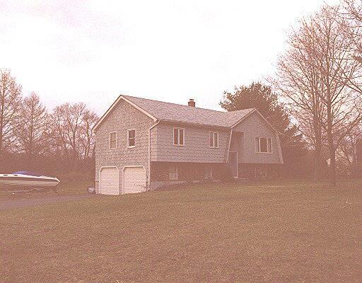 255 Mohegan Road Shelton, CT 06484 - Photo 1 of 1 a view of a house with a yard