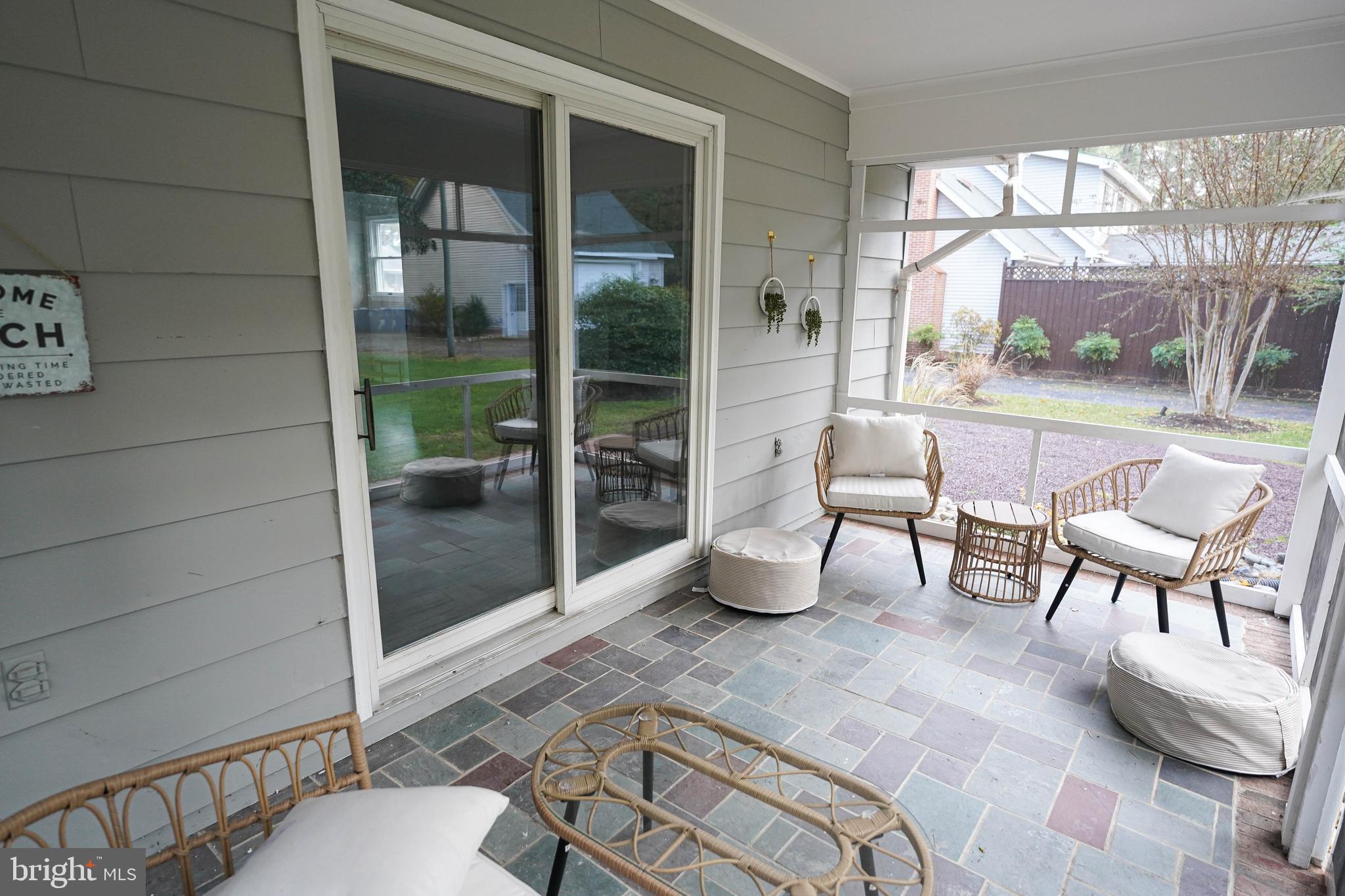 414 Pine Bluff Road Salisbury, MD 21801 - Photo 12 of 91 a living room with furniture and a floor to ceiling window