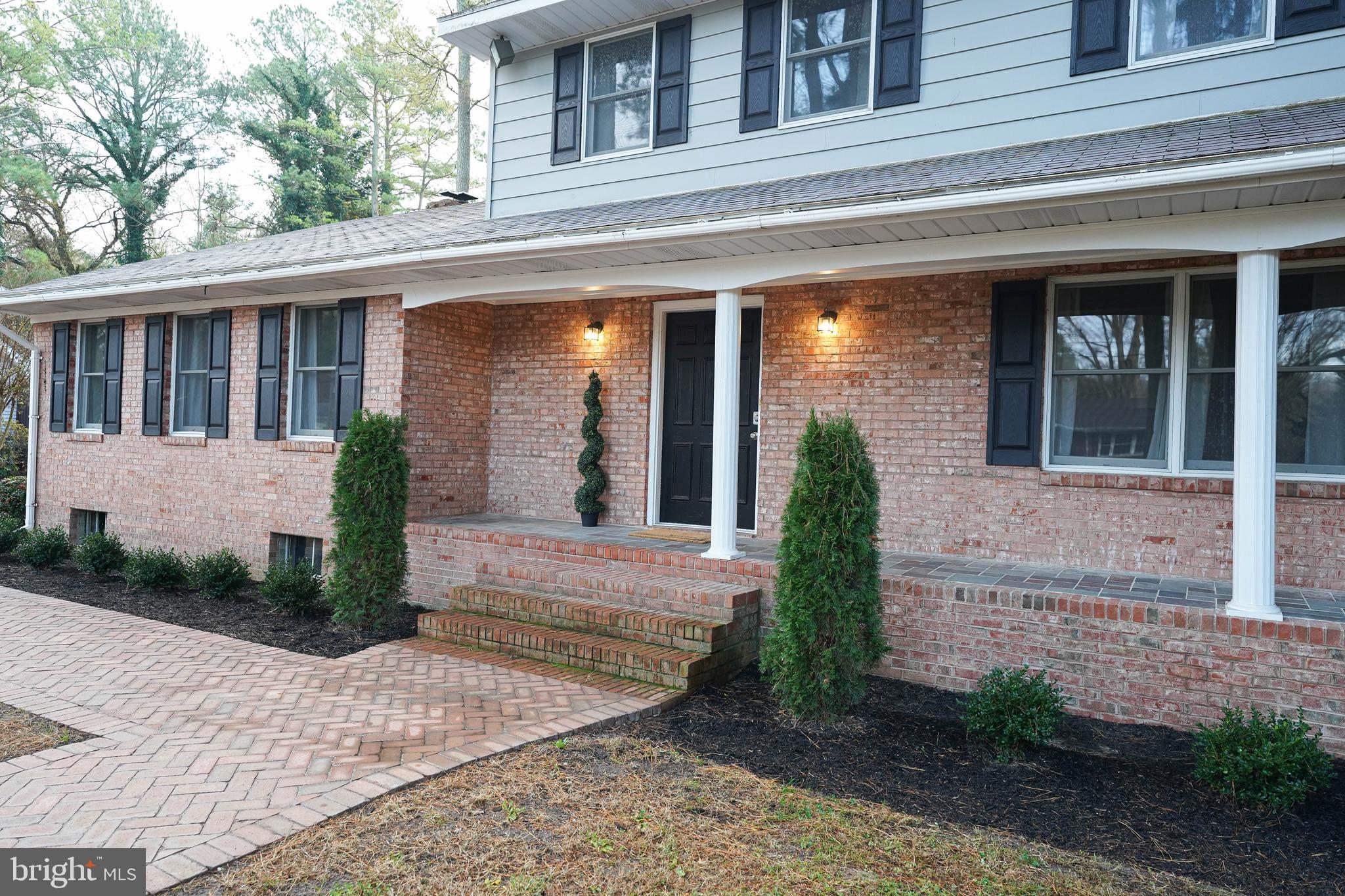 414 Pine Bluff Road Salisbury, MD 21801 - Photo 16 of 91 a front view of a house with garden