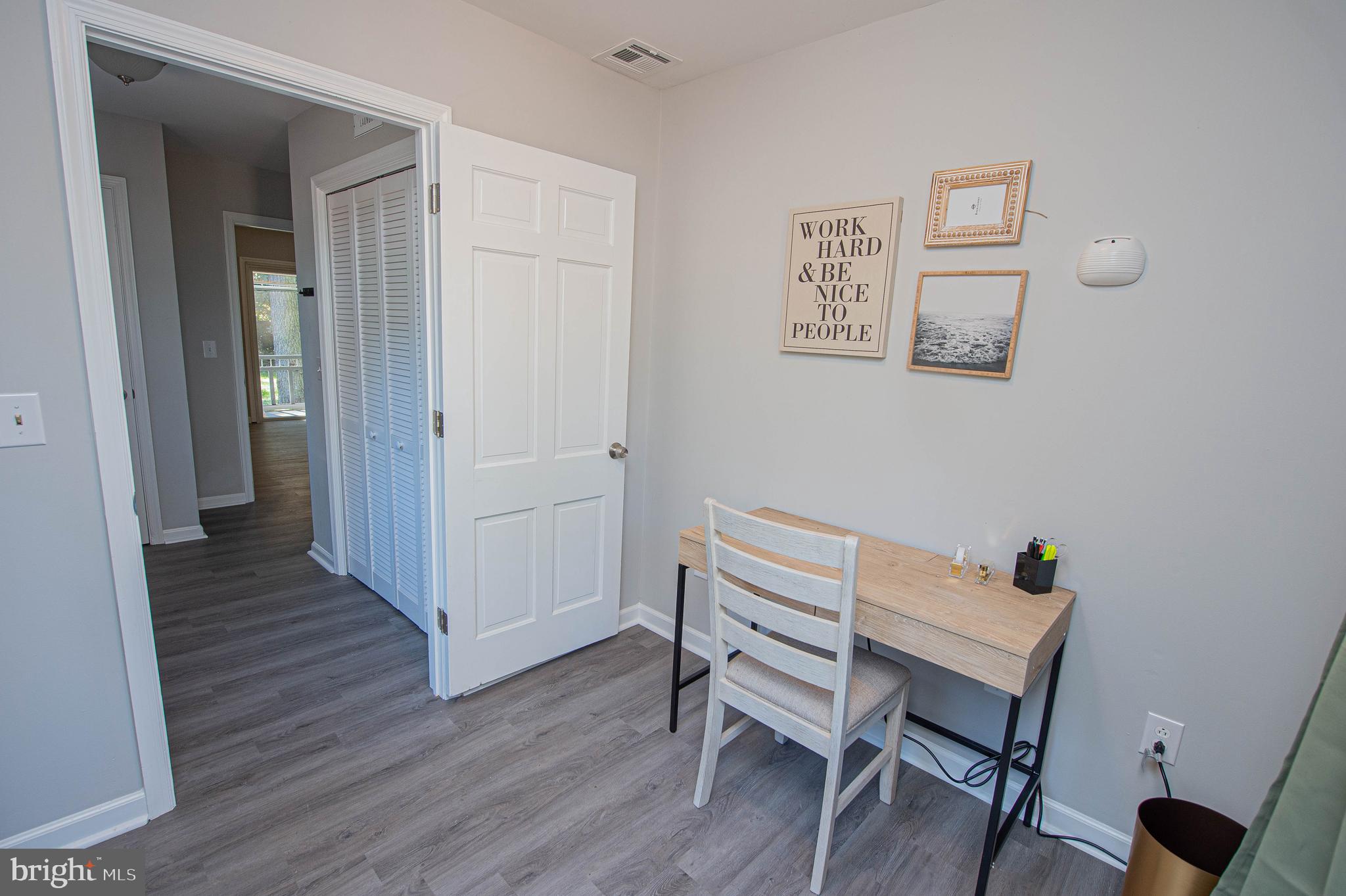 414 Pine Bluff Road Salisbury, MD 21801 - Photo 20 of 91 a view of a hallway with wooden floor and furniture