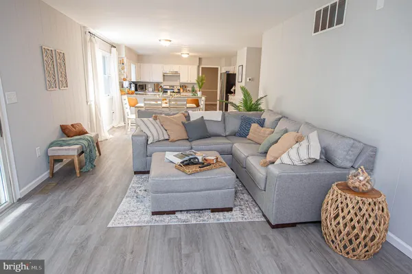 a bedroom with a bed and a dresser in it