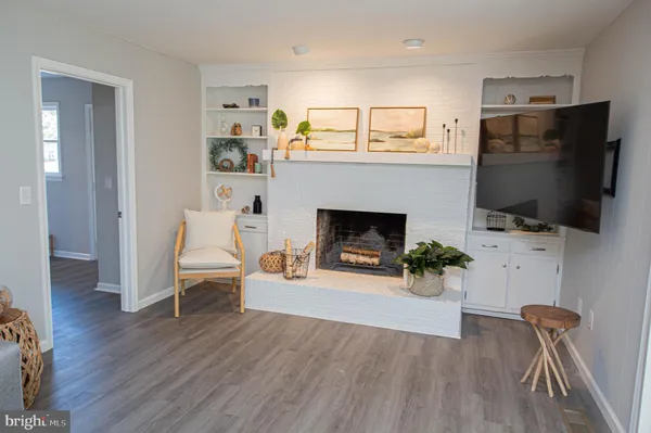 a spacious bedroom with a bed and a chandelier