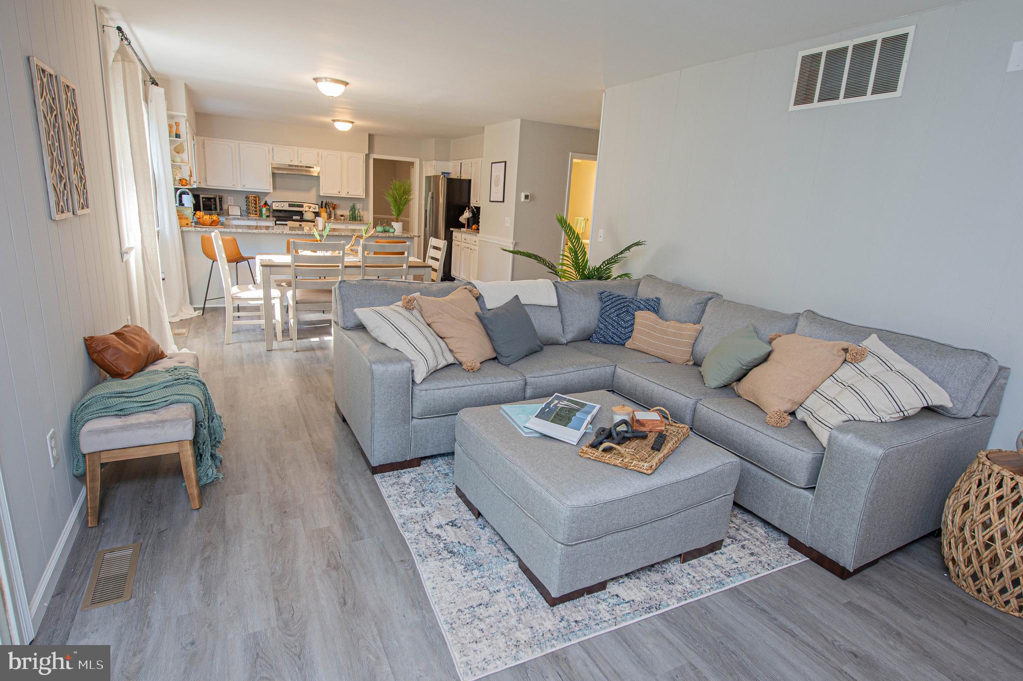 414 Pine Bluff Road Salisbury, MD 21801 - Photo 27 of 91 a living room with furniture kitchen and a table