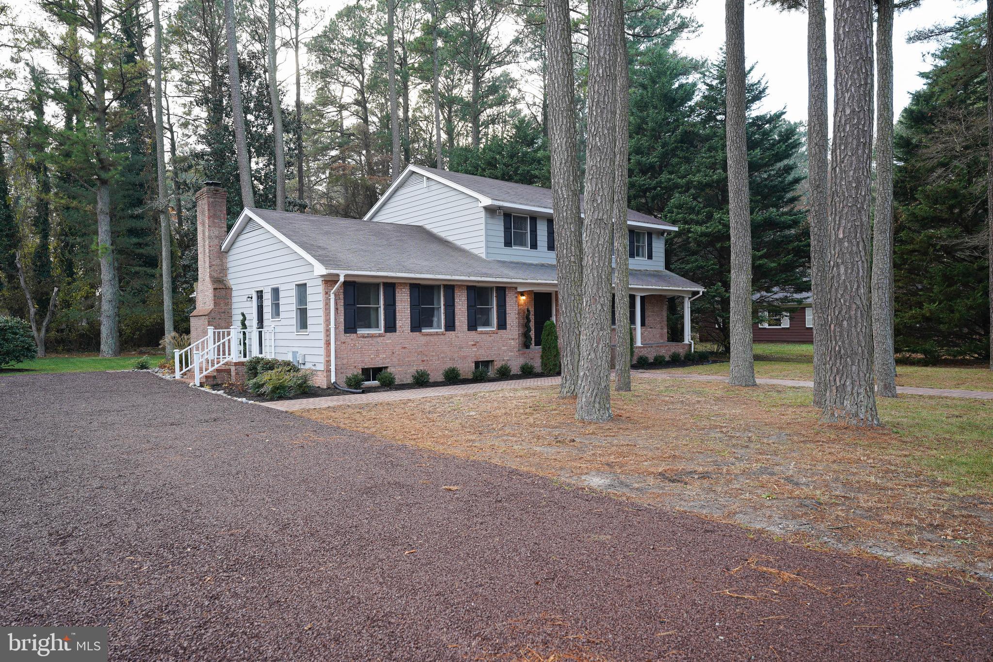 414 Pine Bluff Road Salisbury, MD 21801 - Photo 3 of 91 a front view of a house with a yard and garage