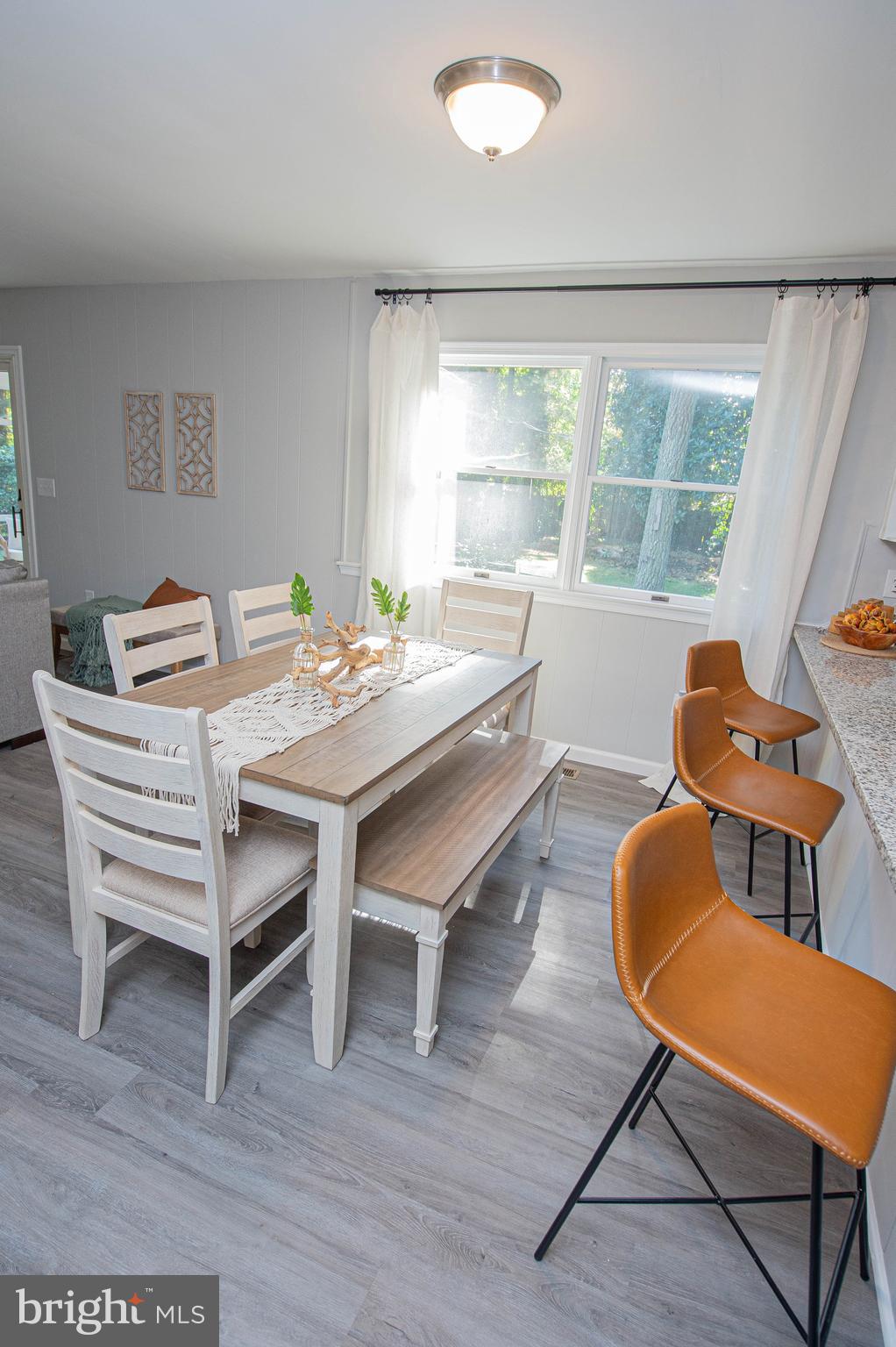 414 Pine Bluff Road Salisbury, MD 21801 - Photo 35 of 91 a dining room with furniture and wooden floor
