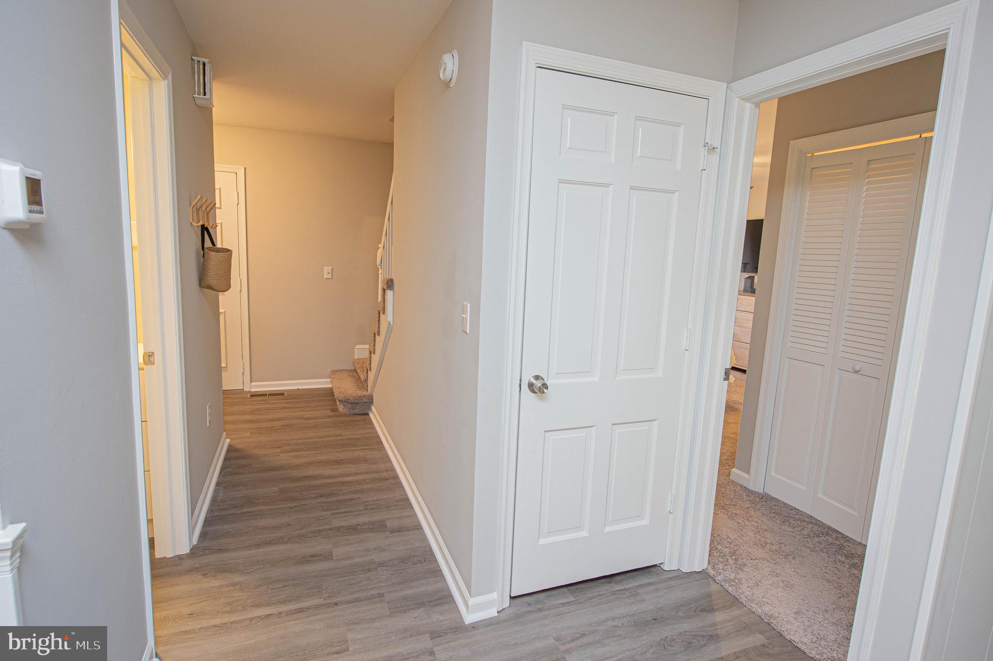 414 Pine Bluff Road Salisbury, MD 21801 - Photo 39 of 91 a view of a hallway with a wooden floor