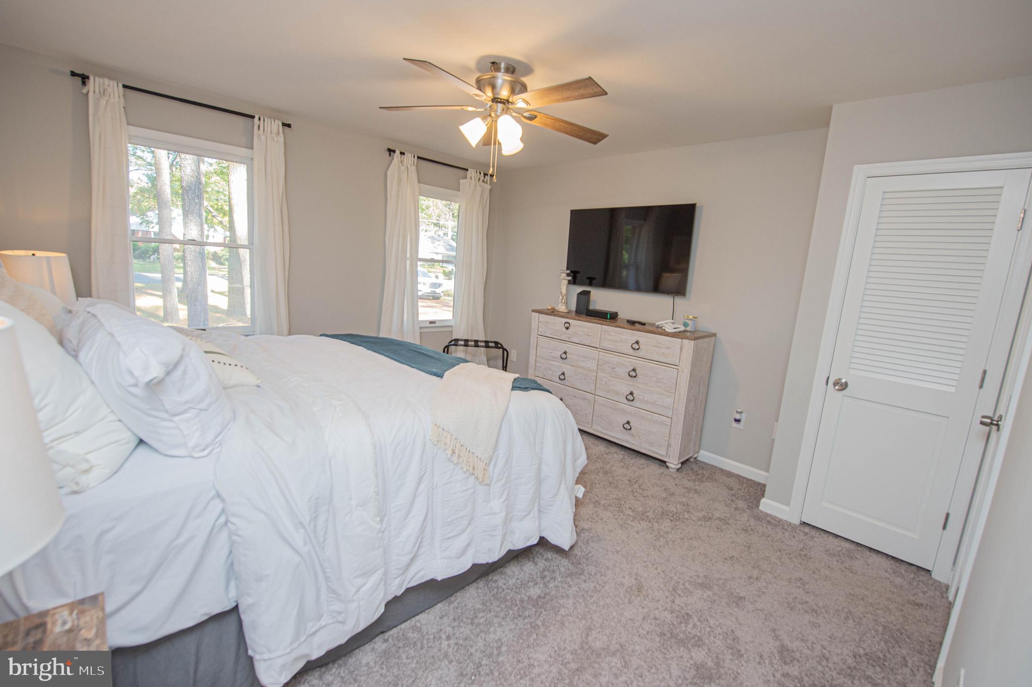 414 Pine Bluff Road Salisbury, MD 21801 - Photo 41 of 91 a bedroom with a bed and a flat screen tv