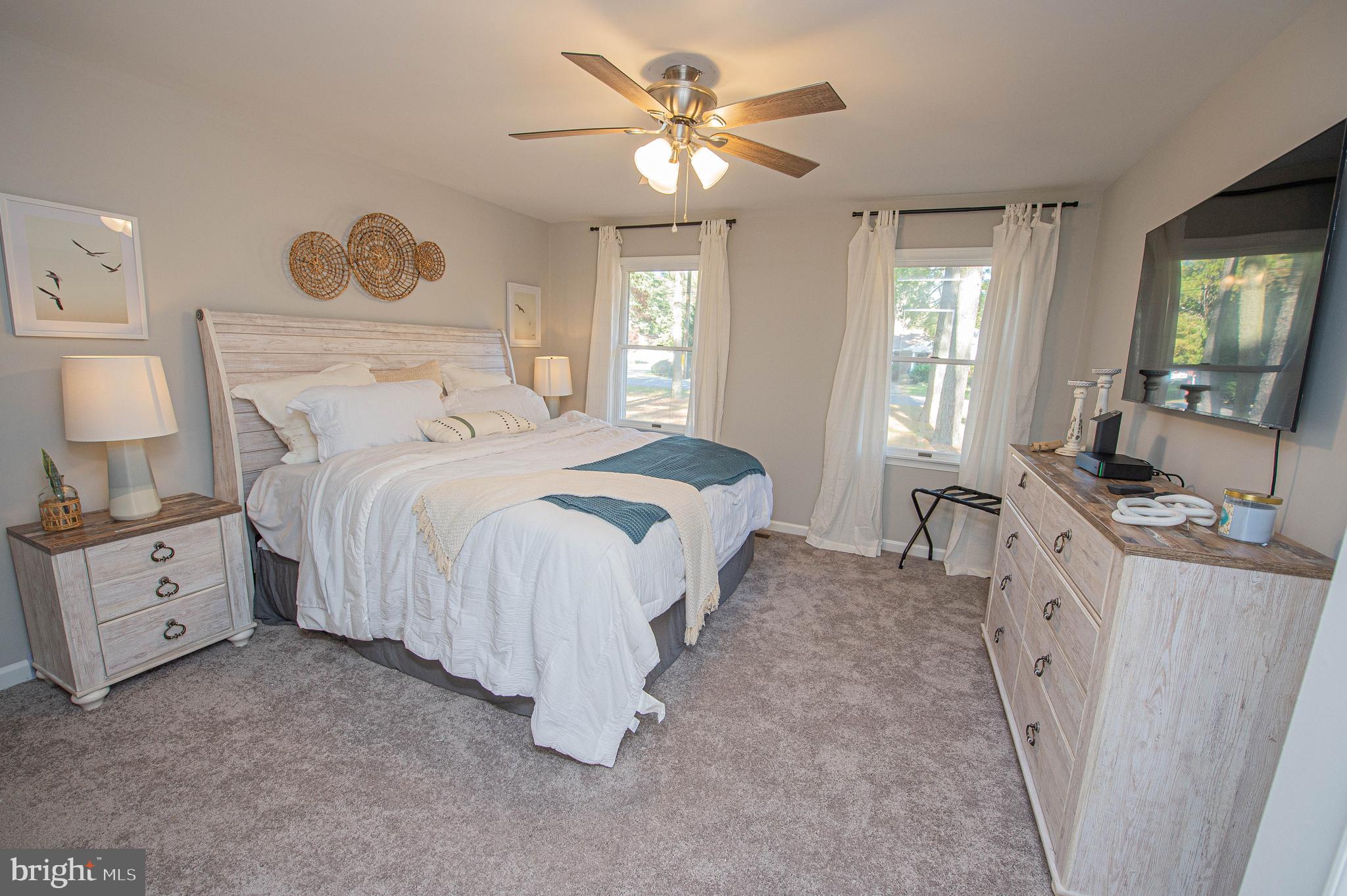 414 Pine Bluff Road Salisbury, MD 21801 - Photo 42 of 91 a spacious bedroom with a bed and a chandelier