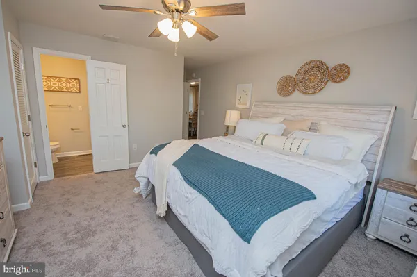 a bedroom with a bed and cabinets