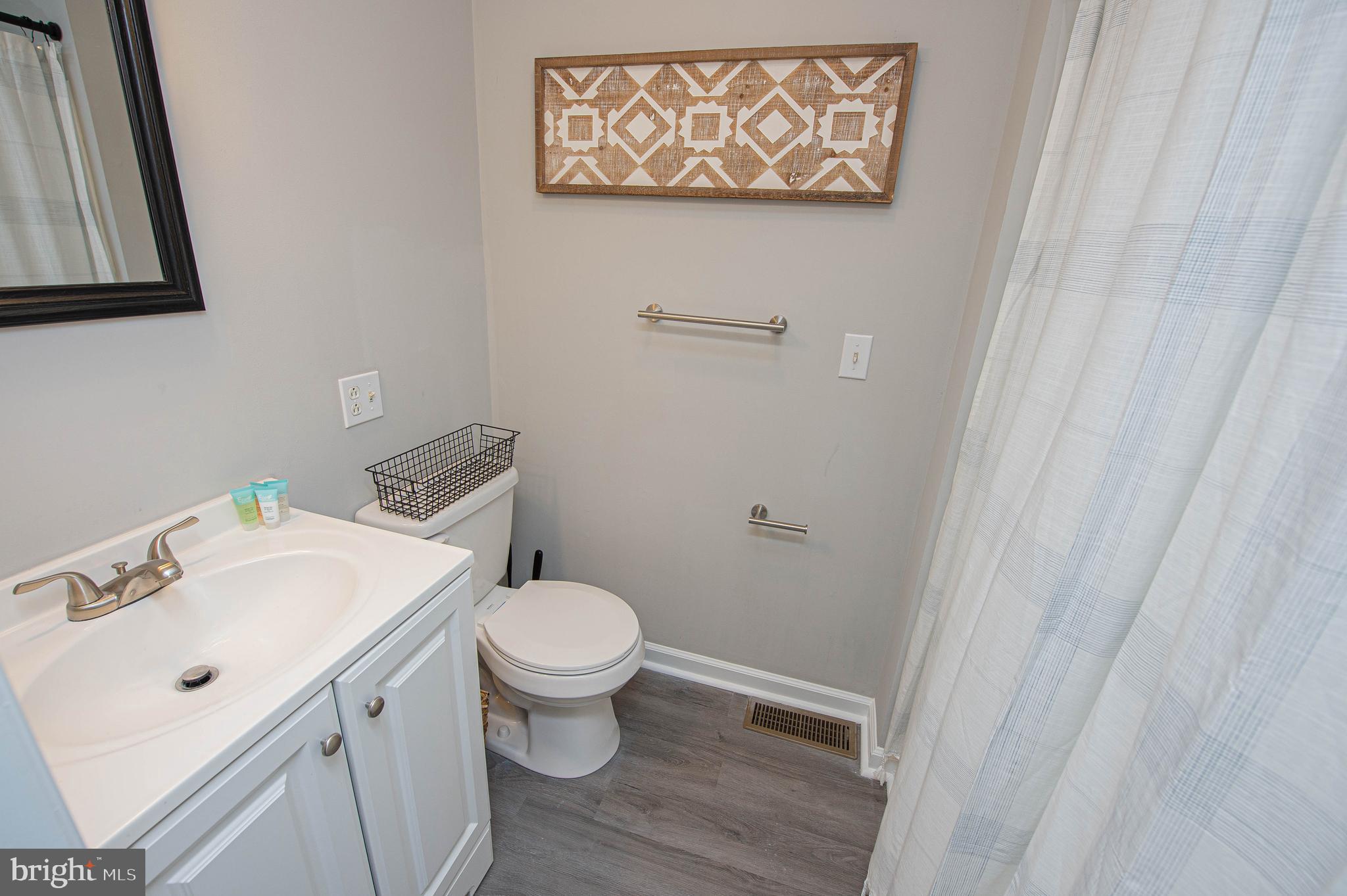 414 Pine Bluff Road Salisbury, MD 21801 - Photo 45 of 91 a bathroom with a sink and a toilet